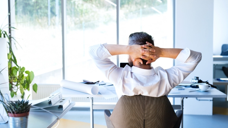 Businessman-at-the-desk-in-his-office-resting.ee44-min